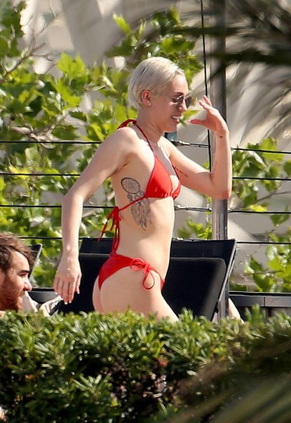 Miley Cyrus – Bikini Candids in Barcelona